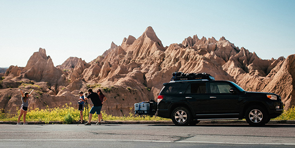 family-taking-picture-badlands-national-park