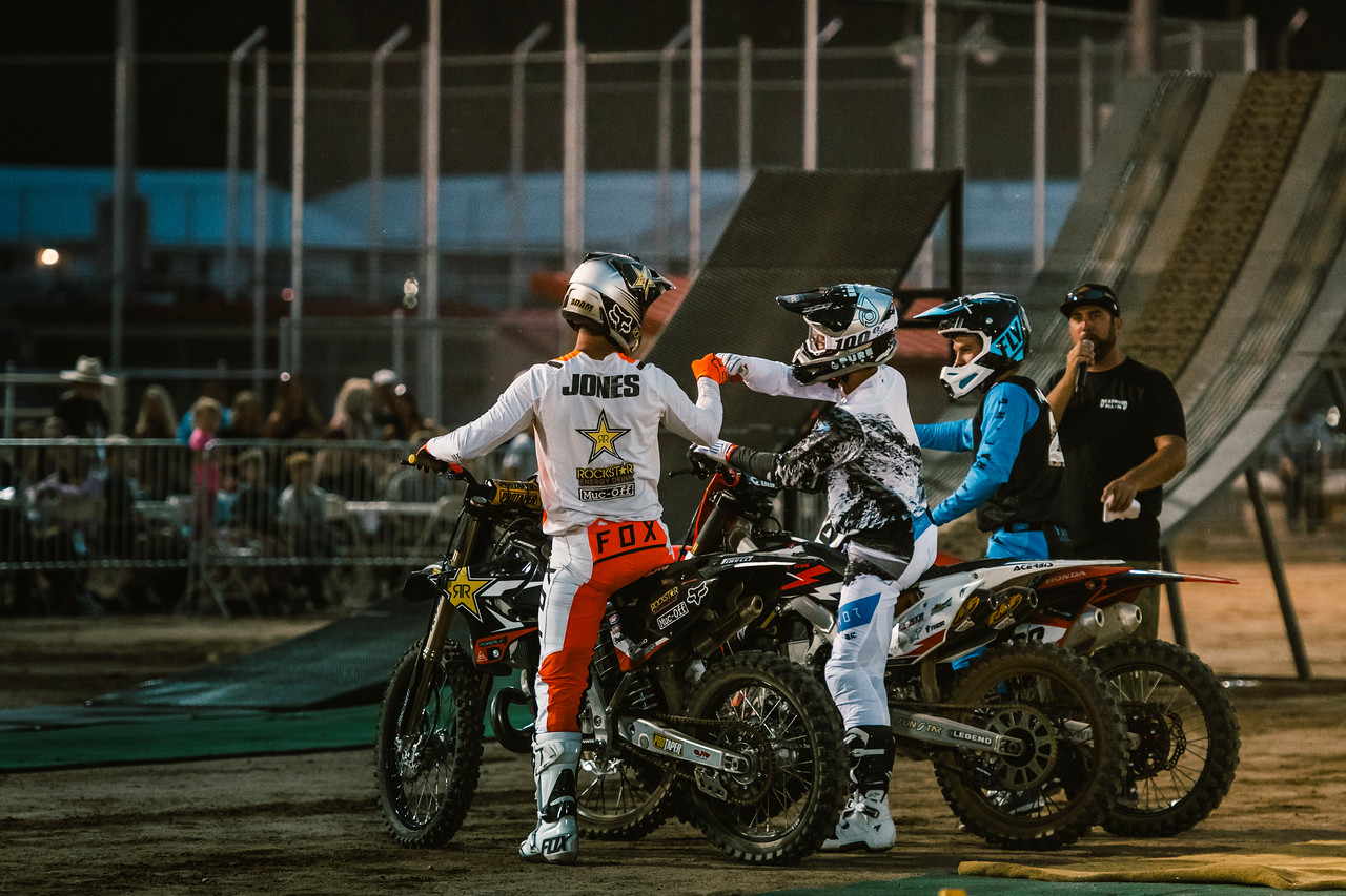 motocross racers giving knucks