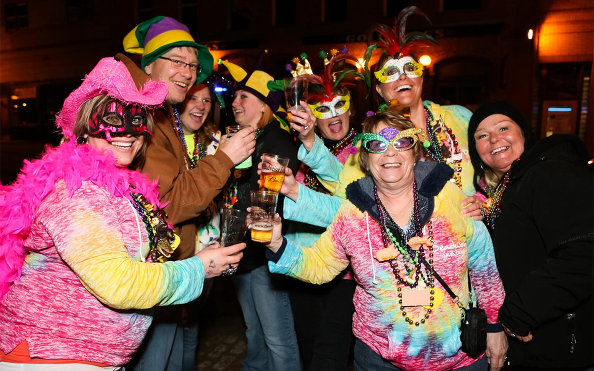 Mardi Gras people cheers-ing